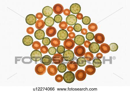 Stock Photograph - Close-up of carrot and cucumber slices. Fotosearch
