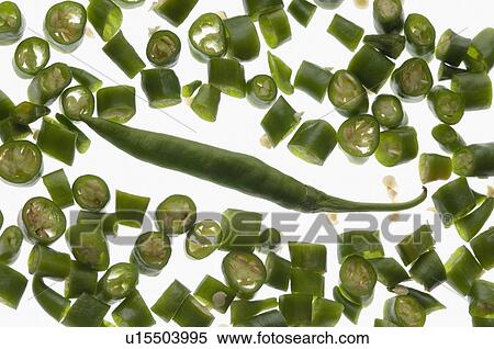 Stock Photography - Close-up of green chili pepper slices. Fotosearch