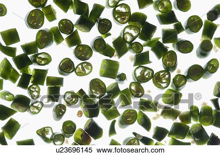 Stock Photography - Close-up of green chili pepper slices. Fotosearch
