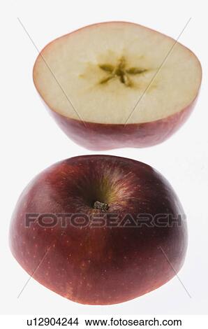 Picture - Close-up of two cross sections of an apple. Fotosearch