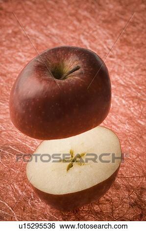 Stock Photograph - Close-up of two cross sections of an apple. Fotosearch
