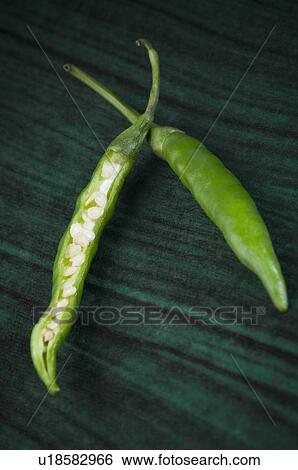 Stock Photograph - Close-up of two green chili peppers. Fotosearch
