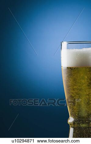 Stock Image - Close-up of a glass of beer. Fotosearch