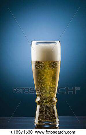 Close-up of a glass of beer View Large Photo Image Stock Image - Close-up of a glass of beer. Fotosearch