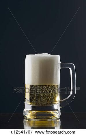Close-up of a glass of beer View Large Photo Image Stock Photo - Close-up of a glass of beer. Fotosearch