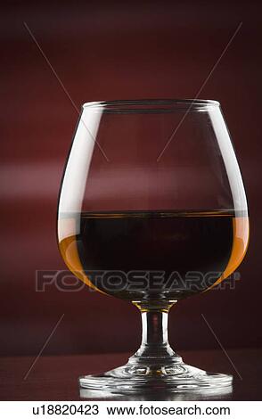 Stock Image - Close-up of a glass of red wine. Fotosearch