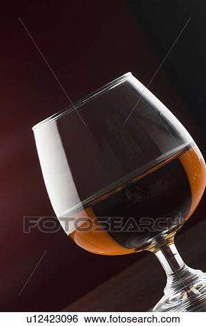 Close-up of a glass of wine View Large Photo Image Stock Photograph - Close-up of a glass of wine. Fotosearch