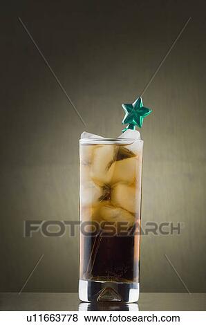 Stock Photo - Close-up of a stirrer in a glass of ice tea. Fotosearch