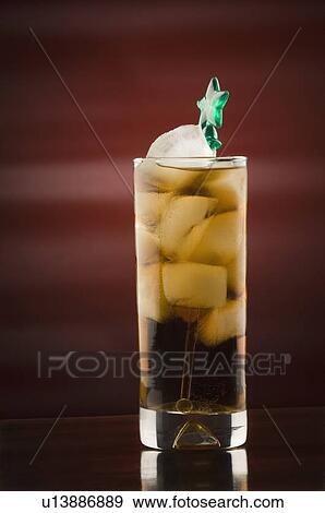 Stock Photo - Close-up of a stirrer in a glass of ice tea. Fotosearch