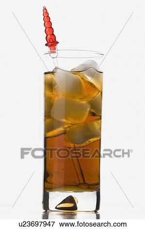 Stock Photo - Close-up of a stirrer in a glass of ice tea. Fotosearch