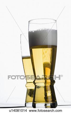 Close-up of two glasses of beer View Large Photo Image Picture - Close-up of two glasses of beer. Fotosearch