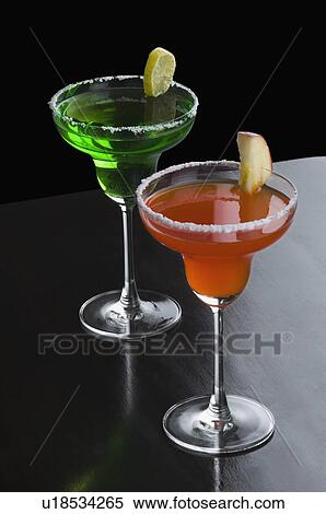Close-up of two glasses of margarita View Large Photo Image Stock Photography - Close-up of two glasses of margarita. Fotosearch