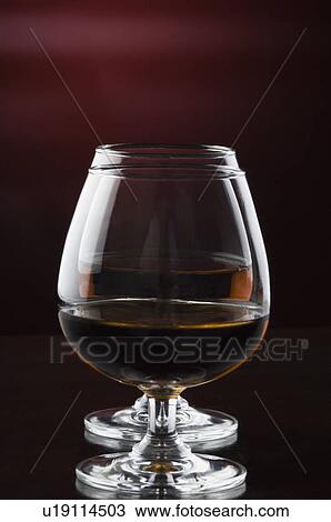 Close-up of two glasses of red wine View Large Photo Image Stock Image - Close-up of two glasses of red wine. Fotosearch