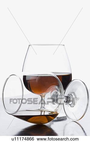 Close-up of two glasses of red wine View Large Photo Image Stock Photograph - Close-up of two glasses of red wine. Fotosearch