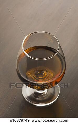 Stock Photo - High angle view of a glass of red wine. Fotosearch