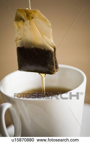 Close-up of a teabag dipped in a cup of tea View Large Photo Image Stock Image - Close-up of a teabag dipped in a cup of tea. Fotosearch