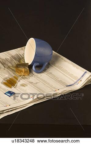 Stock Photo - Tea spilt over a paper. Fotosearch