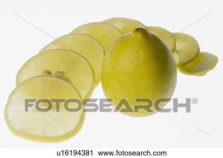 Close-up of a lemon with lemon slices View Large Photo Image Stock Image - Close-up of a lemon with lemon slices. Fotosearch