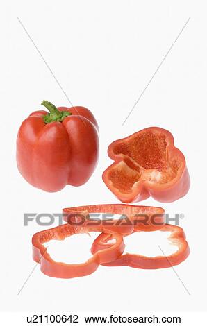 Stock Image - Close-up of a red bell pepper with slices. Fotosearch