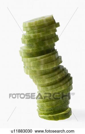 Stock Image - Close-up of a stack of cucumber slices. Fotosearch