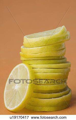 Stock Photo - Close-up of a stack of lemon slices. Fotosearch