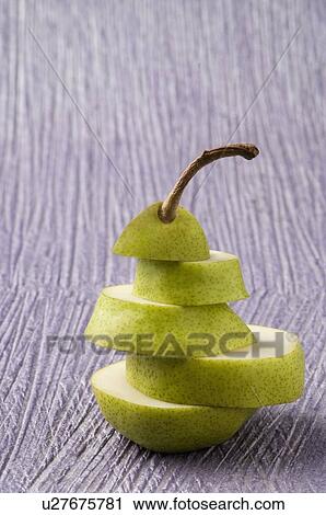 Close-up of a stack of sliced pear View Large Photo Image Stock Image - Close-up of a stack of sliced pear. Fotosearch
