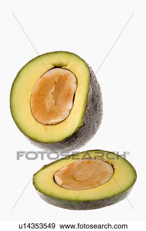 Close-up of cross sections of an avocado View Large Photo Image Stock Photo - Close-up of cross sections of an avocado. Fotosearch