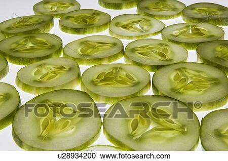 Stock Image - Close-up of cucumber slices. Fotosearch
