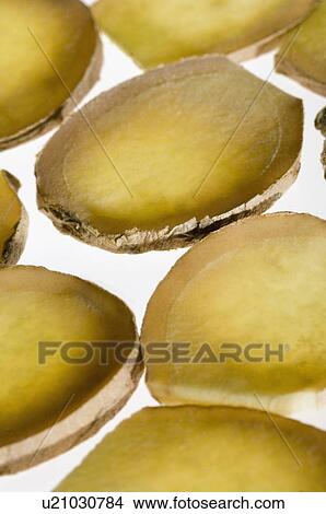 Picture - Close-up of ginger slices. Fotosearch