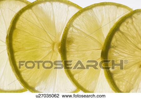 Close-up of lemon slices View Large Photo Image Stock Image - Close-up of lemon slices. Fotosearch