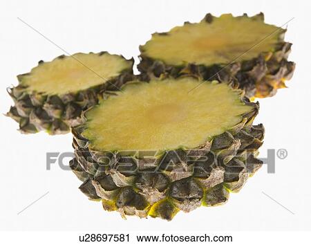 Stock Image - Close-up of pineapple slices. Fotosearch