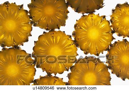 Close-up of pineapple slices View Large Photo Image Stock Photograph - Close-up of pineapple slices. Fotosearch