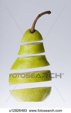 Stock Image - Close-up of sliced pear. Fotosearch