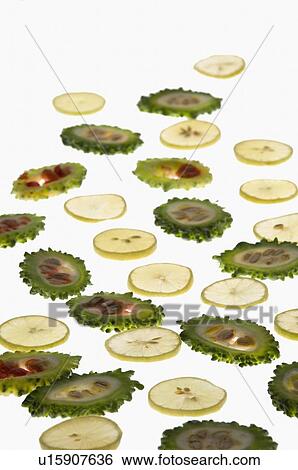 Close-up of slices of bitter melon and lemon View Large Photo Image Stock Photograph - Close-up of slices of bitter melon and lemon. Fotosearch