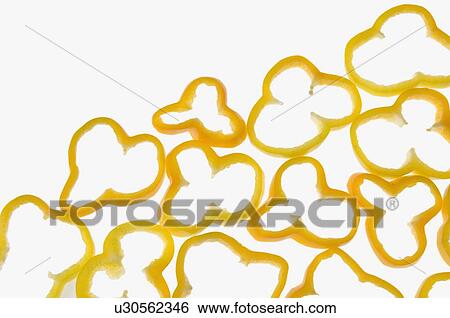 Stock Photograph - Close-up of yellow bell pepper slices. Fotosearch