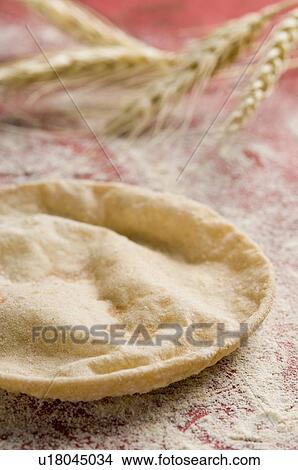 Picture - Close-up of a chapatti with husk of wheat. Fotosearch