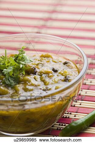 Stock Photography - Close-up of chickpea curry in a glass bowl. Fotosearch