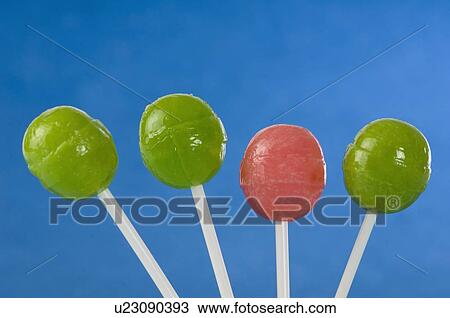 Stock Image - Close-up of four lollipops. Fotosearch