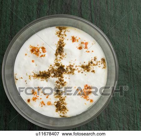 Stock Photo - Close-up of rayta in a glass bowl. Fotosearch