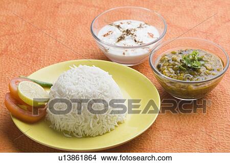 Close-up of rice in a plate with chickpea curry and rayta View Large Photo Image Picture - Close-up of rice in a plate with chickpea curry and rayta. Fotosearch
