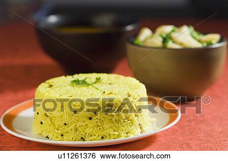 Close-up of rice in a plate with lentils and pees with potato slices View Large Photo Image Stock Photograph - Close-up of rice in a plate with lentils and pees with potato slices. Fotosearch