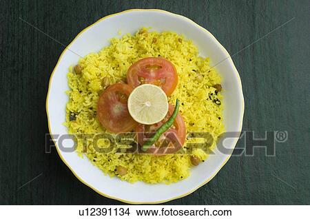 Picture - High angle view of fried rice in a ceramic bowl. Fotosearch