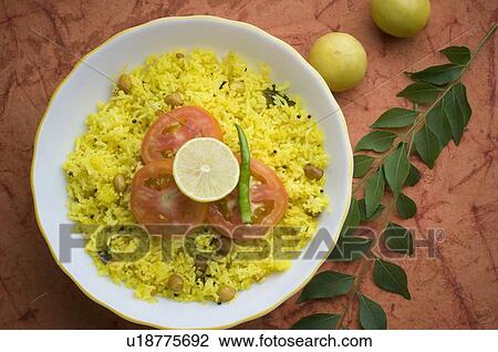 Stock Image - High angle view of fried rice in a ceramic bowl. Fotosearch