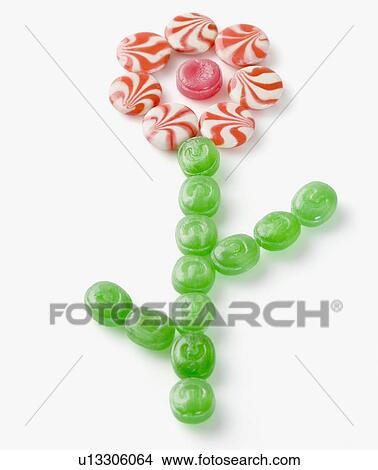 High angle view of multi-colored candies arranged in the form of a flower View Large Photo Image Picture - High angle view of multi-colored candies arranged in the form of a flower. Fotosearch