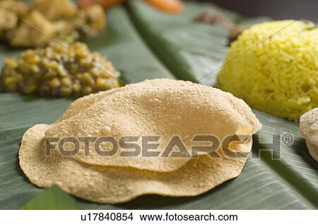 Indian cuisine served on a banana leaf View Large Photo Image Picture - Indian cuisine served on a banana leaf. Fotosearch