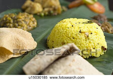 Stock Photography - Indian cuisine served on a banana leaf. Fotosearch