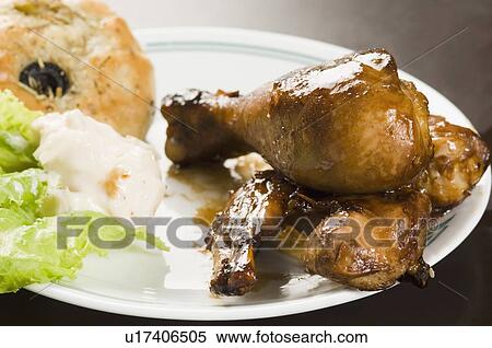 Close-up of fried chicken drumsticks in a plate View Large Photo Image Stock Photography - Close-up of fried chicken drumsticks in a plate. Fotosearch
