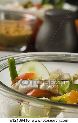 Stock Image - Close-up of raw vegetables in a bowl. Fotosearch