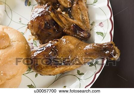 Close-up of roast chickens in a plate View Large Photo Image Stock Image - Close-up of roast chickens in a plate. Fotosearch