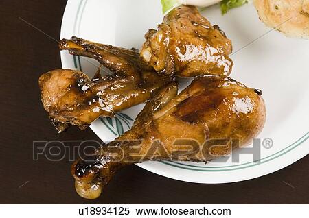 Close-up of roast chickens in a plate View Large Photo Image Stock Photography - Close-up of roast chickens in a plate. Fotosearch